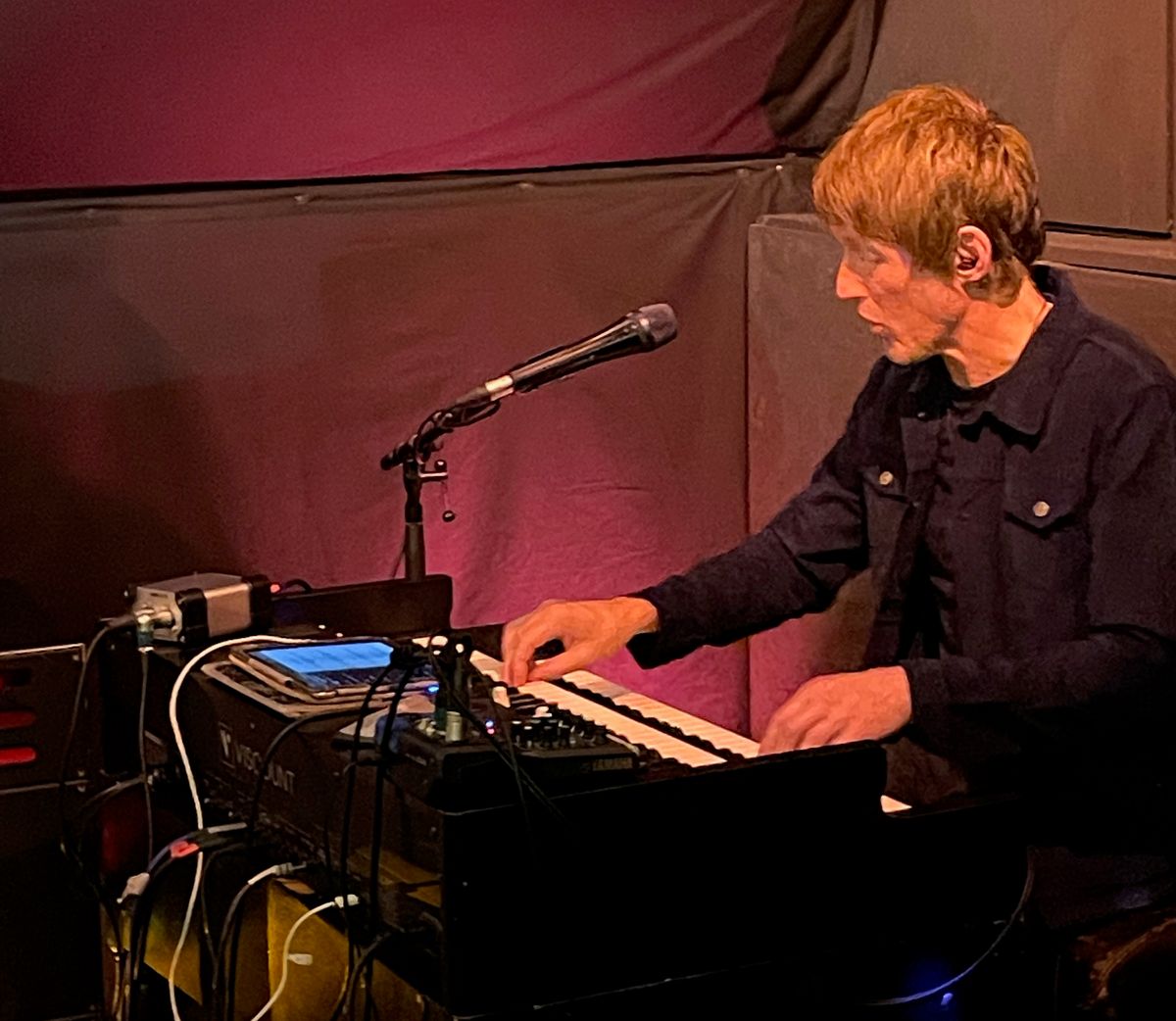 Image of the Southbound stage with a mircophone in the foreground.